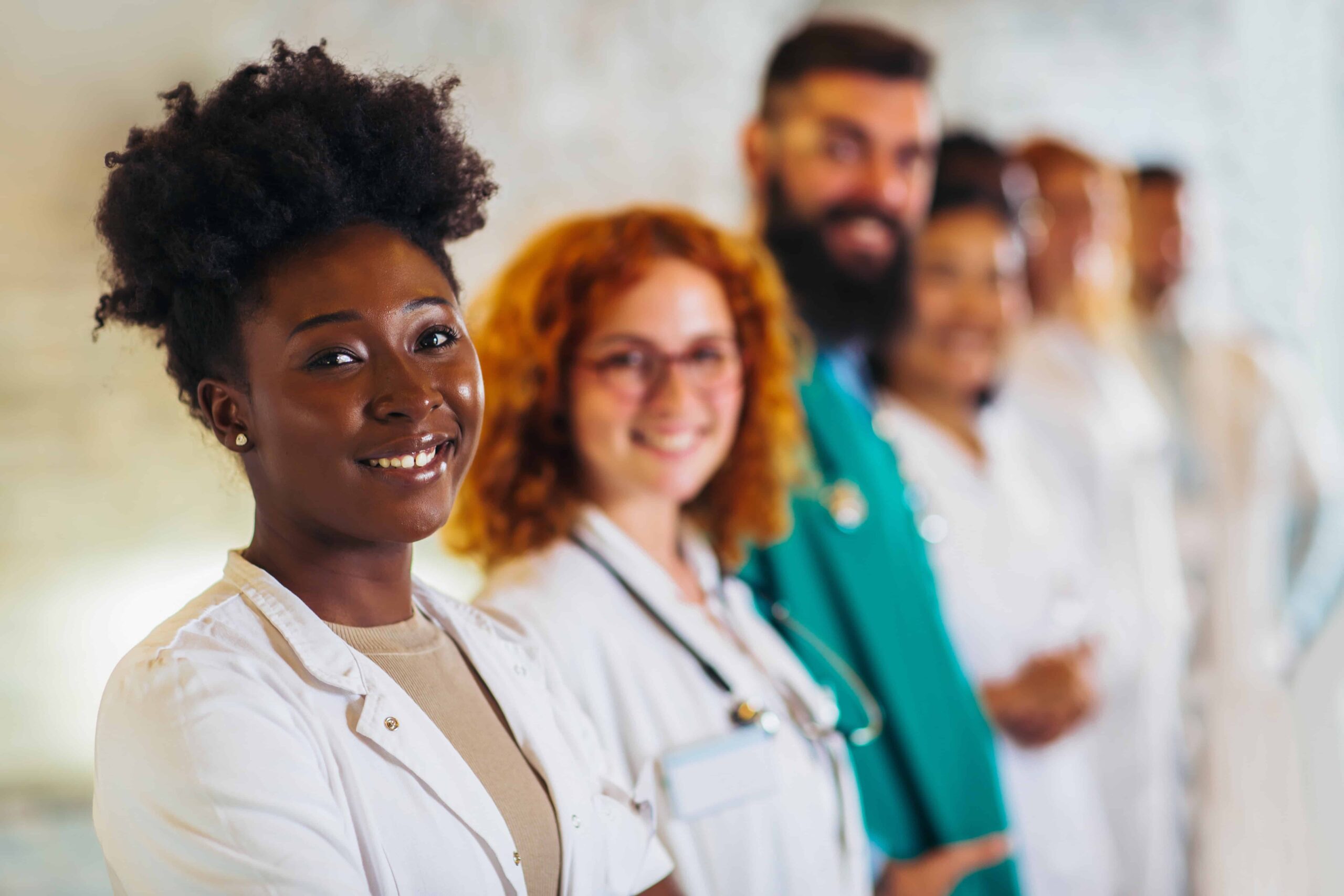 AdobeStock_478335998 group of happy doctors at hospital