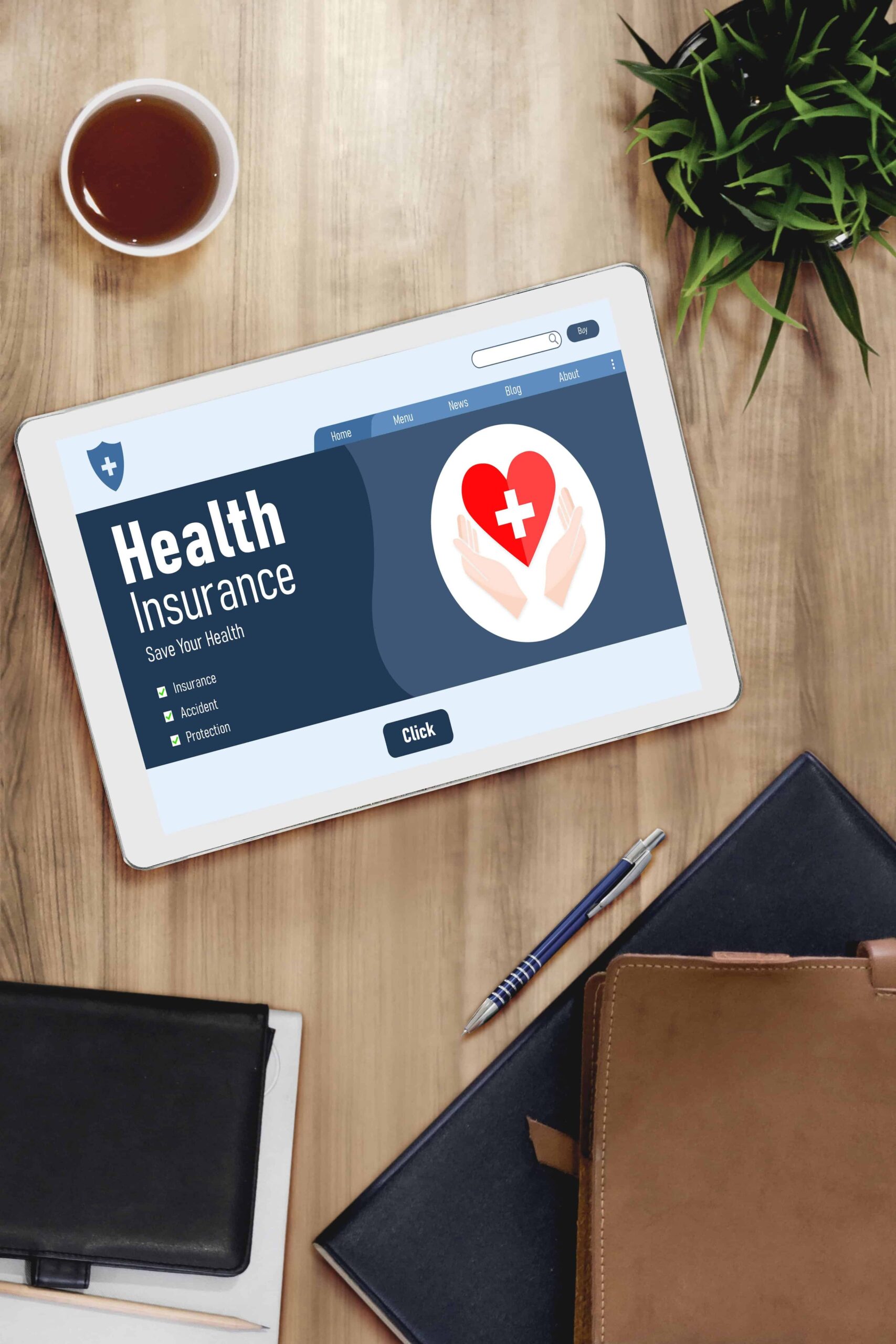AdobeStock_596179196 Health insurance web site modish registration system showing on tablet laying on wood desk